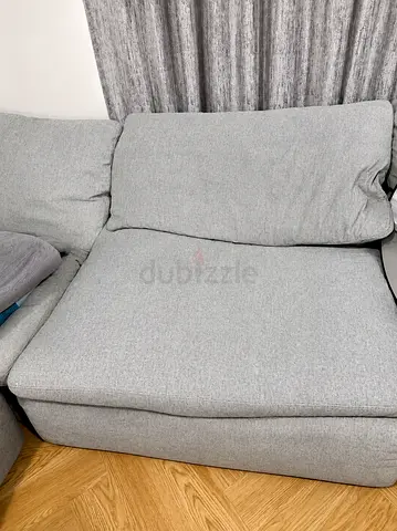 Light grey fabric sofa seat section (corner/chaise piece)
