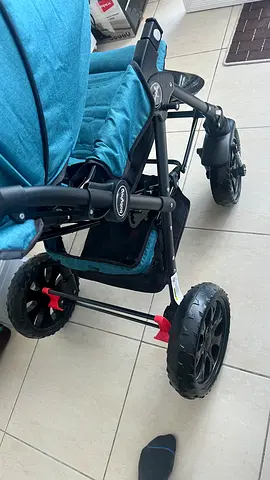 Brand new 4-wheel baby stroller - sturdy frame, spacious seat.