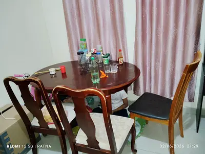 Wooden dining table for sale with three wooden chairs