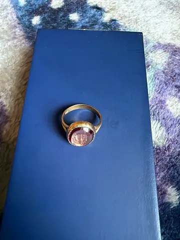 Gold-toned ring with large pink gemstone - one piece