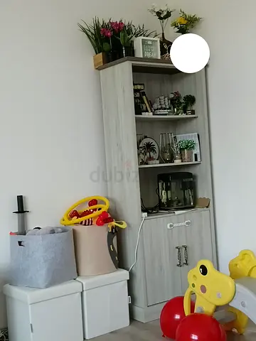 Tall light-wood bookcase with cabinet - good condition