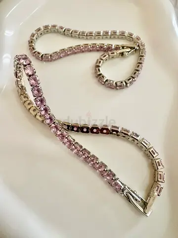Silver-tone tennis bracelet with light pink stones