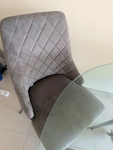 Round Glass table and 4 x quilted grey chairs