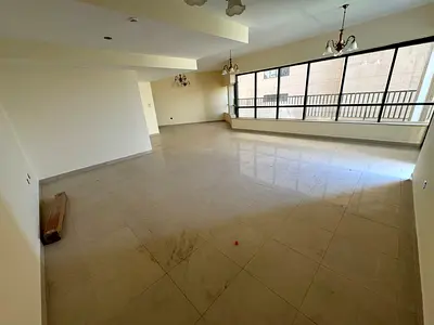 Three-bedroom apartment with a living room for annual rent in Al Majaz 2, featuring four bathrooms, a master maid's room, a large terrace, free parkin