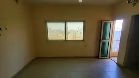 Studio for annual rent in Al Bu Tinah separate kitchen balcony open view split AC central gas free p