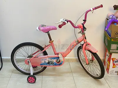 Pink girls 20-inch bike with training wheels - used