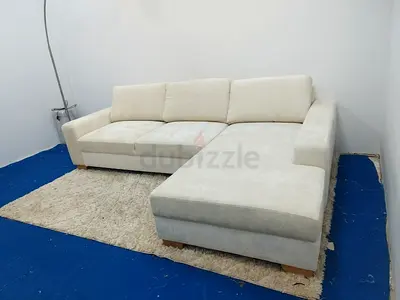 Beige color Ikea lshape sofa with chaise storage