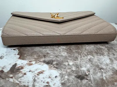 Beige quilted leather clutch bag YSL with gold hardware (pre-owned)