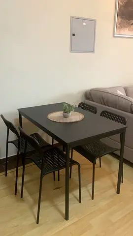 Black 4-Seater Dining Table with Chairs - Brand New Condition