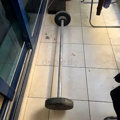 Used barbell with weight plates - basic home gym set