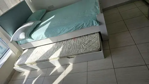 White wooden trundle single bed with mattress - good condition