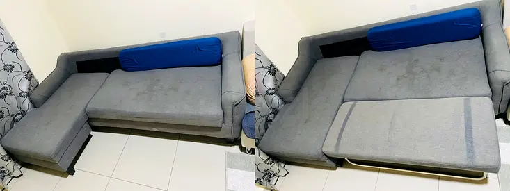 Grey L-shaped convertible sofa - pull-out bed section, good for small living rooms