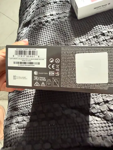 Unopened electronic device box (rear/side view) — sealed packaging