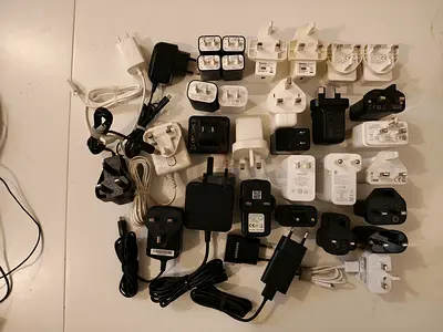 Collection of various power adapters and charging cables
