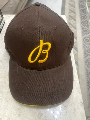 Breitling Brown baseball cap with yellow embroidered logo, gently used