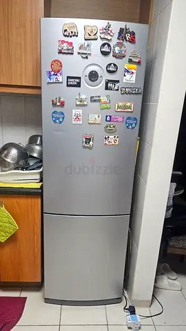 Used stainless steel fridge with bottom freezer - good working condition