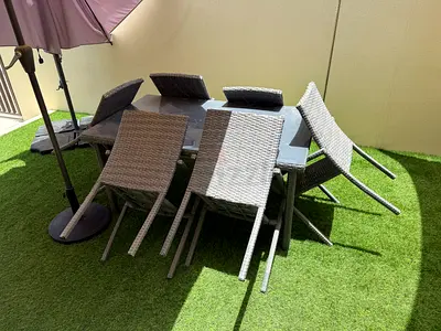 Outdoor rattan dining table with 6 chairs