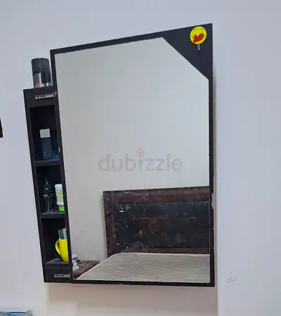 Wall-mounted mirror with attached shelving - dark wood finish