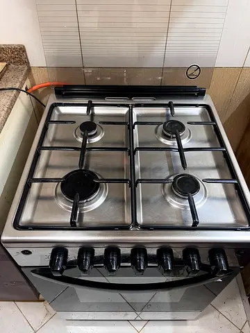 Used 4-Burner Stainless Steel Gas Stove with Oven - Good Working Condition