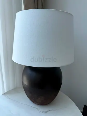 Brown ceramic table lamp with white fabric shade
