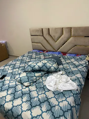Queen bed with upholstered headboard and mattress (used)