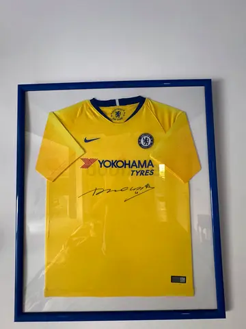 Framed Chelsea FC away jersey signed by Didier Drogba
