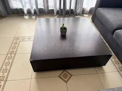 Low dark wood coffee table / platform with storage