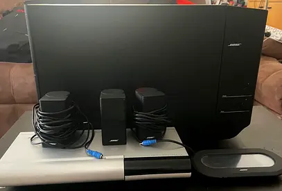 Bose subwoofer, speakers, cd player and remote control