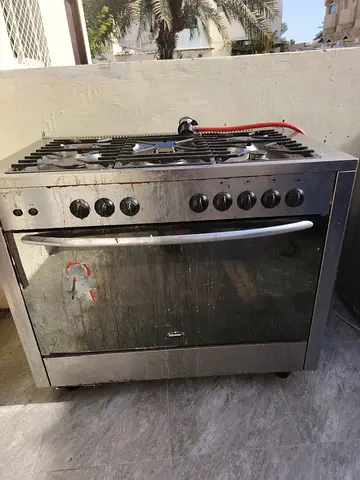 Used freestanding gas oven and 5-burner stove - needs cleaning