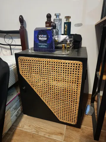 Black bedside cabinet with woven rattan front - single drawer