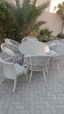Outdoor 8-piece White Wicker Dining Set with Round Table