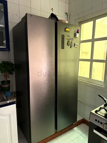 Side-by-side stainless steel refrigerator - good working condition