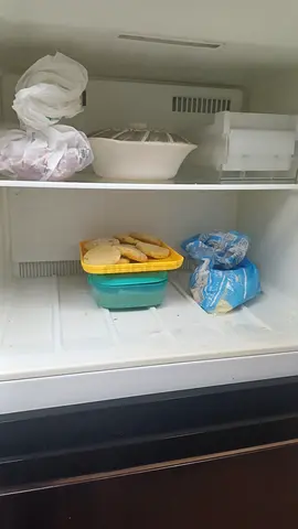 Compact freezer with stored food items - used, working