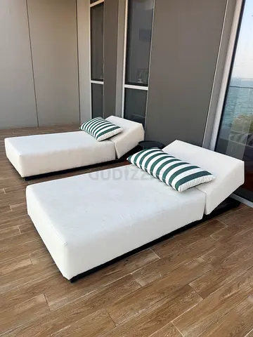Modern white modular sofa chaise (2-piece) - good condition. Pillows not included. Tanning beds.