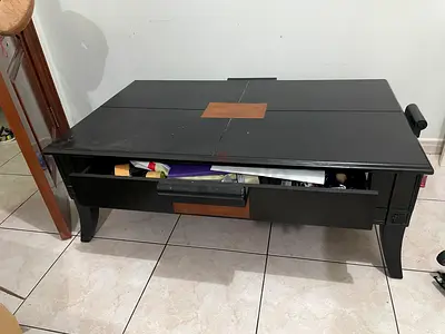Black wooden coffee table with storage drawer (used)