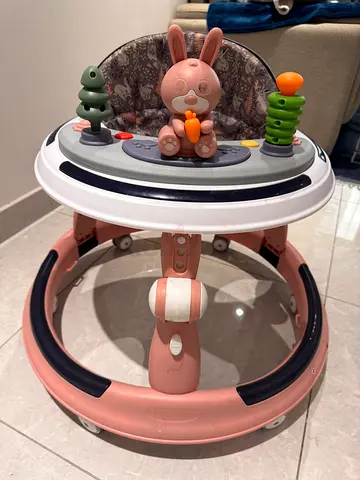 Pink baby walker with activity tray and seat - good condition