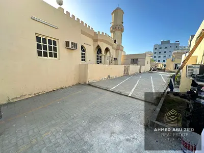 For rent: an Arabic house in Al Bustan, Ajman, with two bedrooms, a living room, a kitchen, and 2 bathrooms, suitable for staff accommodation, near th