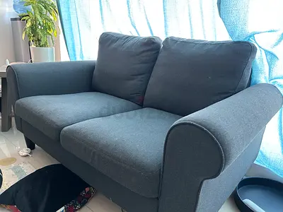 Dark grey 2-seater sofa — good condition