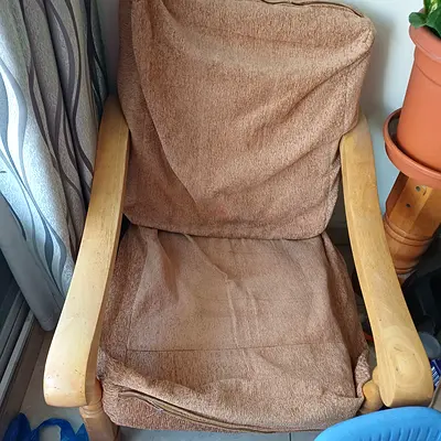 Wooden frame armchair with removable brown cushions