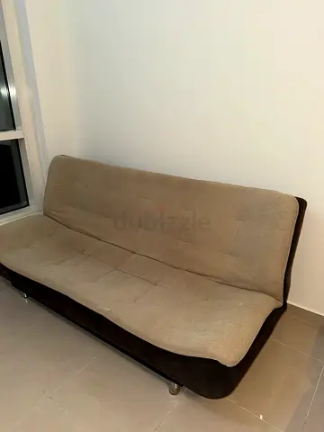 Compact 2-seater sofa bed in beige and brown - good condition