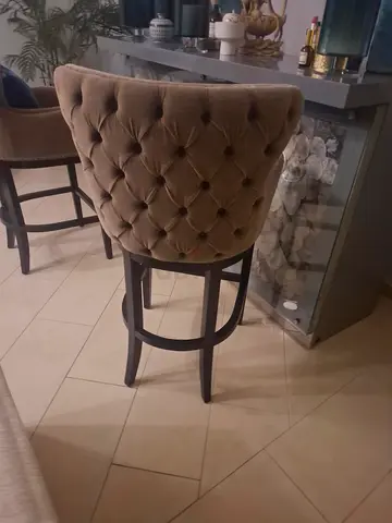 Two Upholstered Bar Stools with Studded Detail