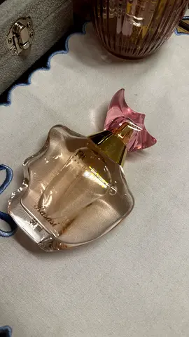 Used womens perfume bottle (partially full) - floral scent
