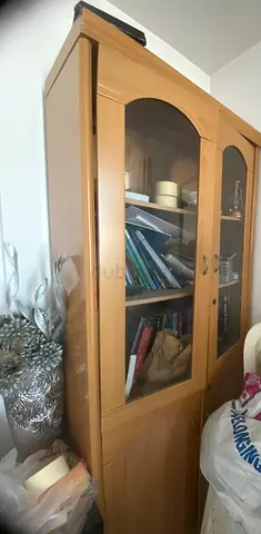 Light wood display cabinet with glass doors - good condition