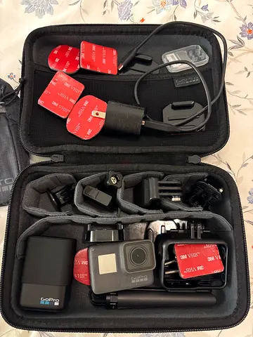 GoPro Hero 5 camera with extra accessories: mount, case, helmet stickers and cage, 2x batteries, etc