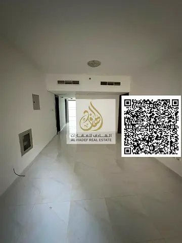 Annual rent in Ajman, King Faisal Street – 1BR + hall, 2 baths, balcony, master room, central AC, free maintenance. AED 30,000 in 4 payments, deposit