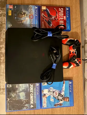 Sony PS4 Slim console with 2 controllers and 5 PS4 games (Good working condition)