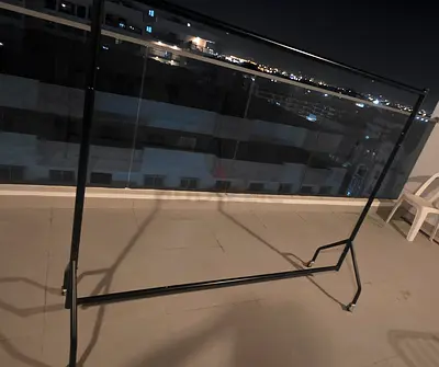 Simple metal garment/clothes rack on wheels - good condition