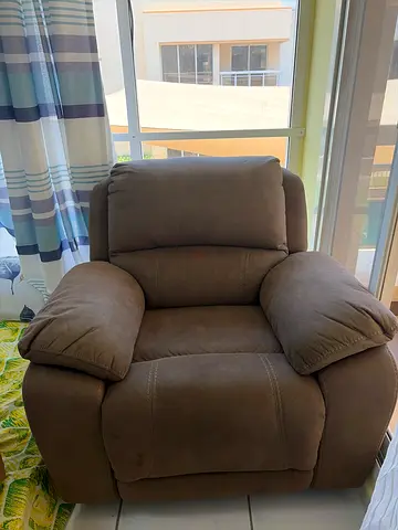 Single brown rocker recliner armchair in good condition
