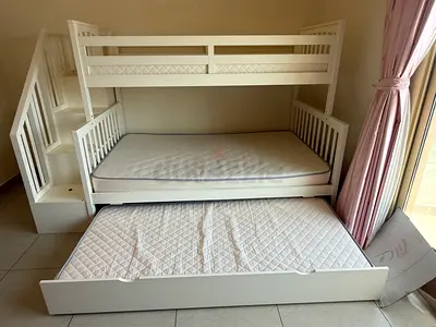 White wooden bunk bed with trundle and storage stairs - good condition