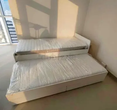 Ikea slakt bed frame with under bed and 2 storage drawers underneath with 2 Ikea mattresses is avail